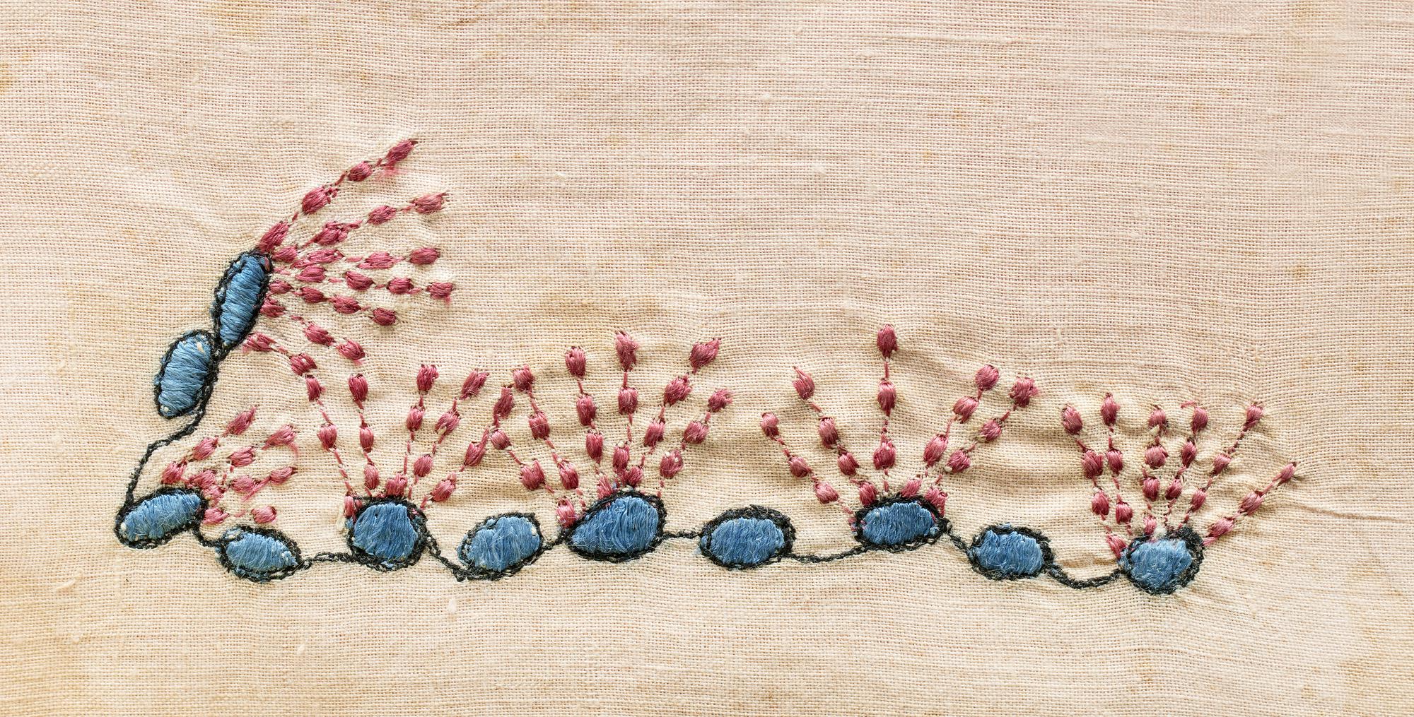embroidered floral patch on linen